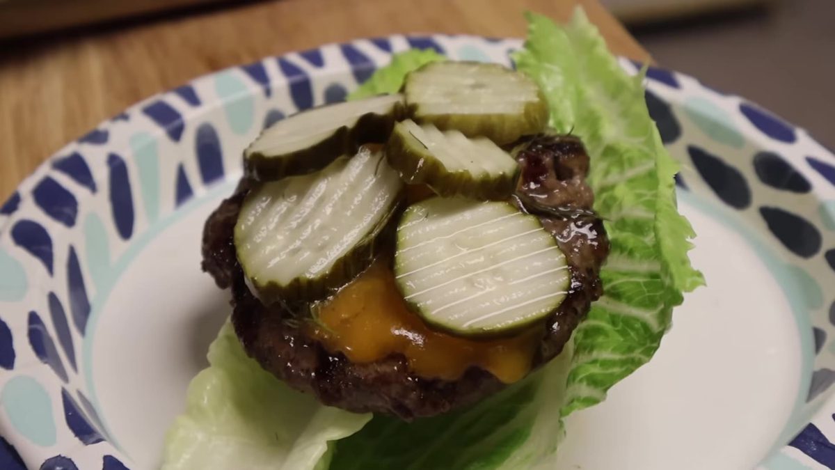 Lettuce-wrap finish for the cooked burgers