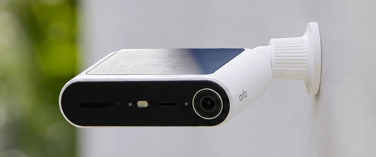 Arlo Essential Solar Security Camera mounted on an outside wall